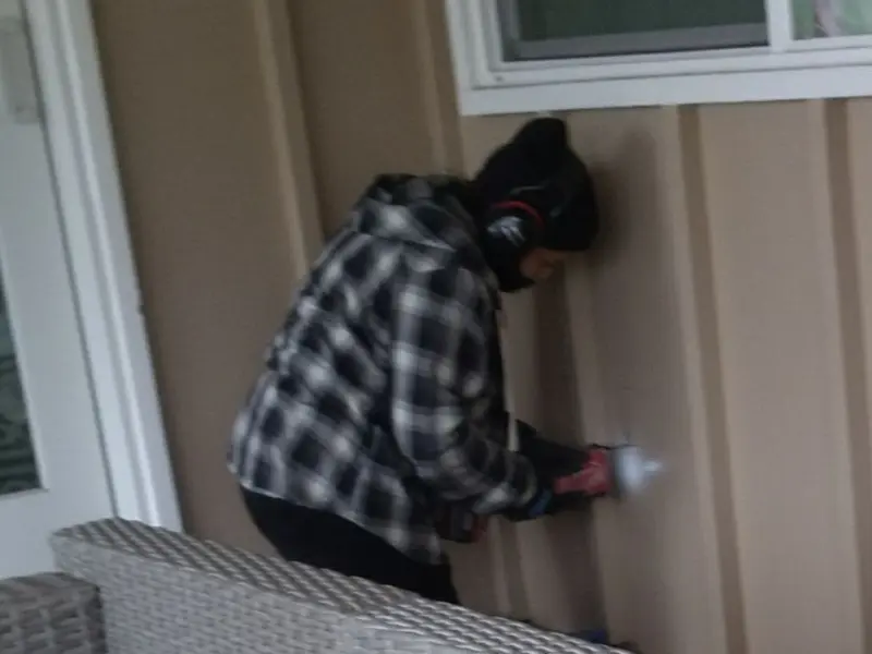 Professional electrician installing an exterior outlet in Elizabethtown