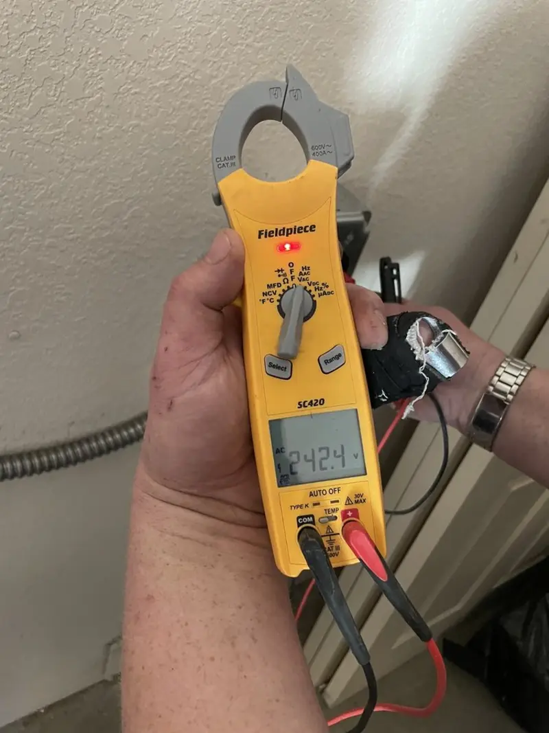 Voltage testing with clamp meter during Recessed Lighting Installation in Elizabethtown